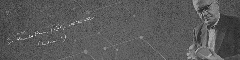 Headshot of Sir Alexander Fleming holding a perti dish open