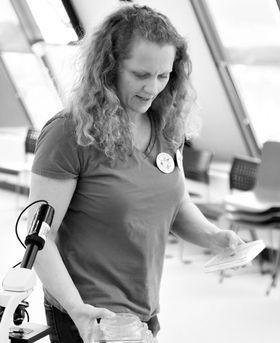 Photo of Ruth Maclaren with a microscope.