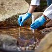 scientist with water sample
