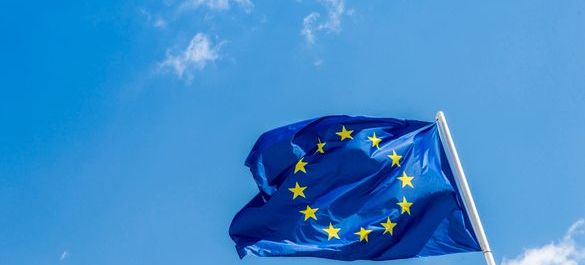 EU flag blowing in the wind on a sunny day. 