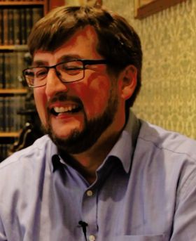 Headshot of Greg Challis.